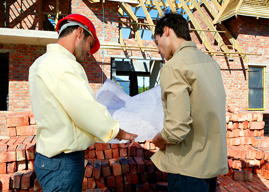Contractor helping a client discuss construction plans