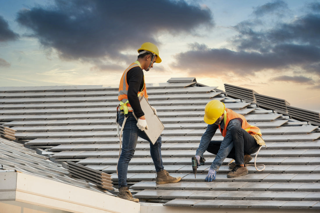 Two roofing contractors working on a roof in Florida