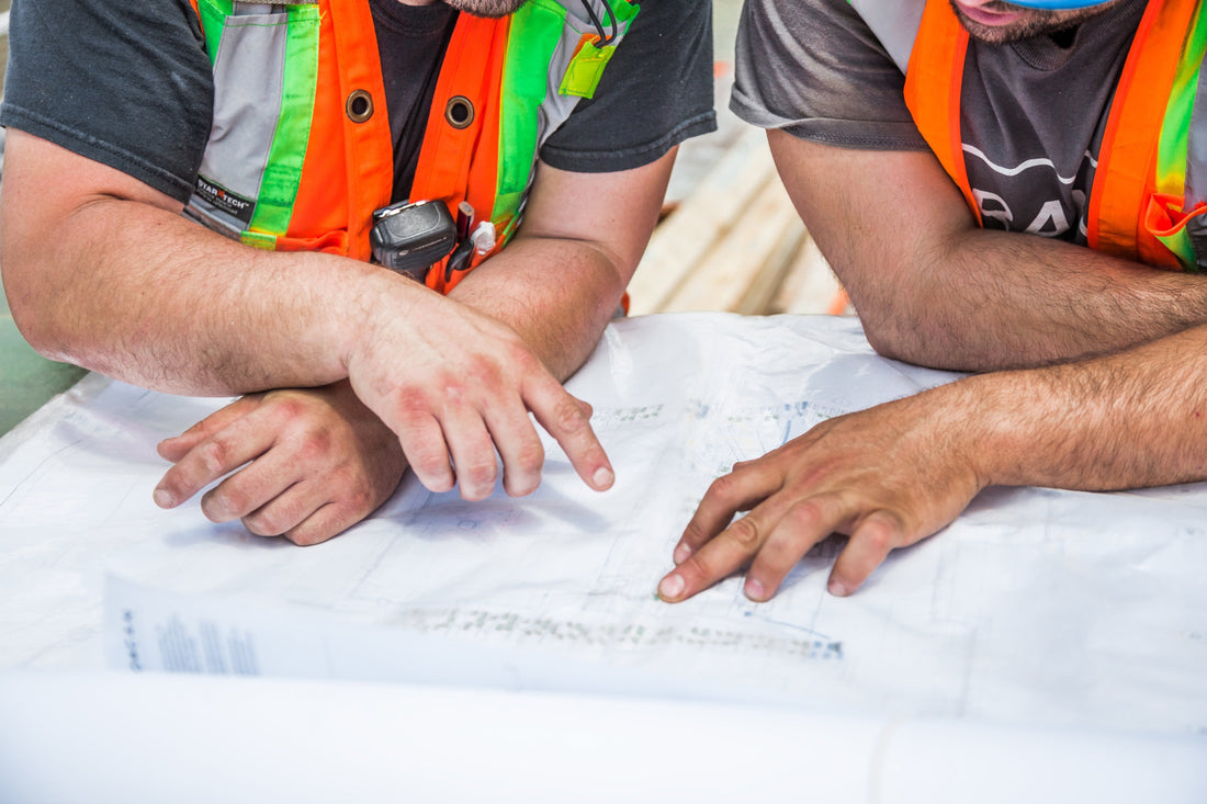 licensed contractors with no experience looking at blueprints