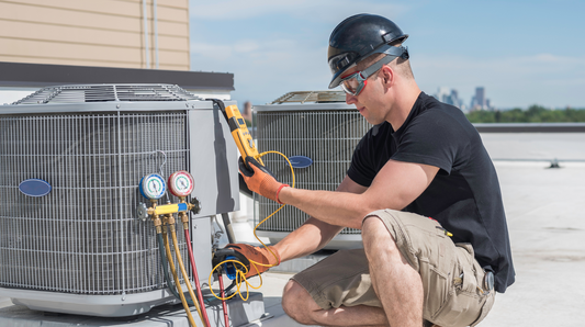 HVAC contractor working on an a/c unit
